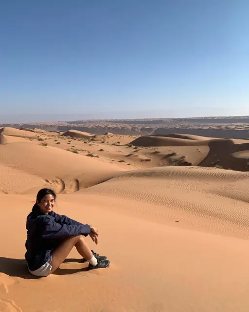 Mirjan resting on desert sand dunes