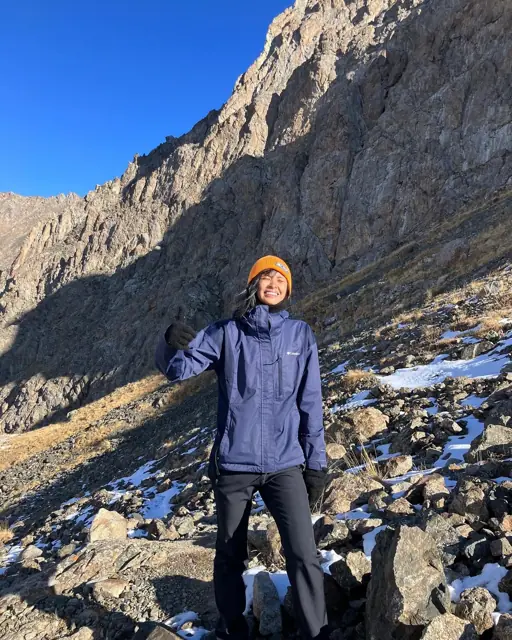 Mirjan on a rocky, snow-dusted mountain trail